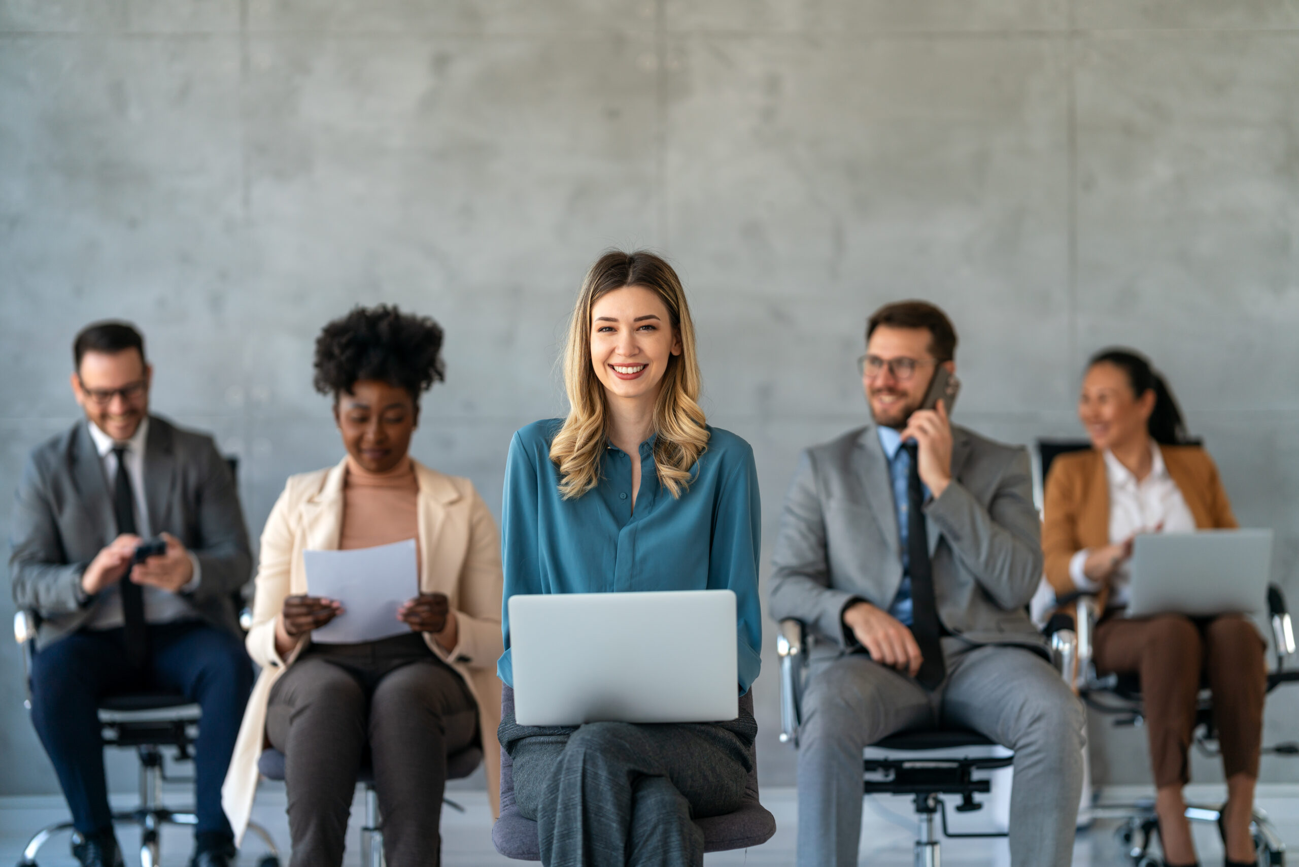 CEO businesswoman leader with diverse coworkers team, executive managers group at meeting. Multicultural professional businesspeople working together on research plan in boardroom.